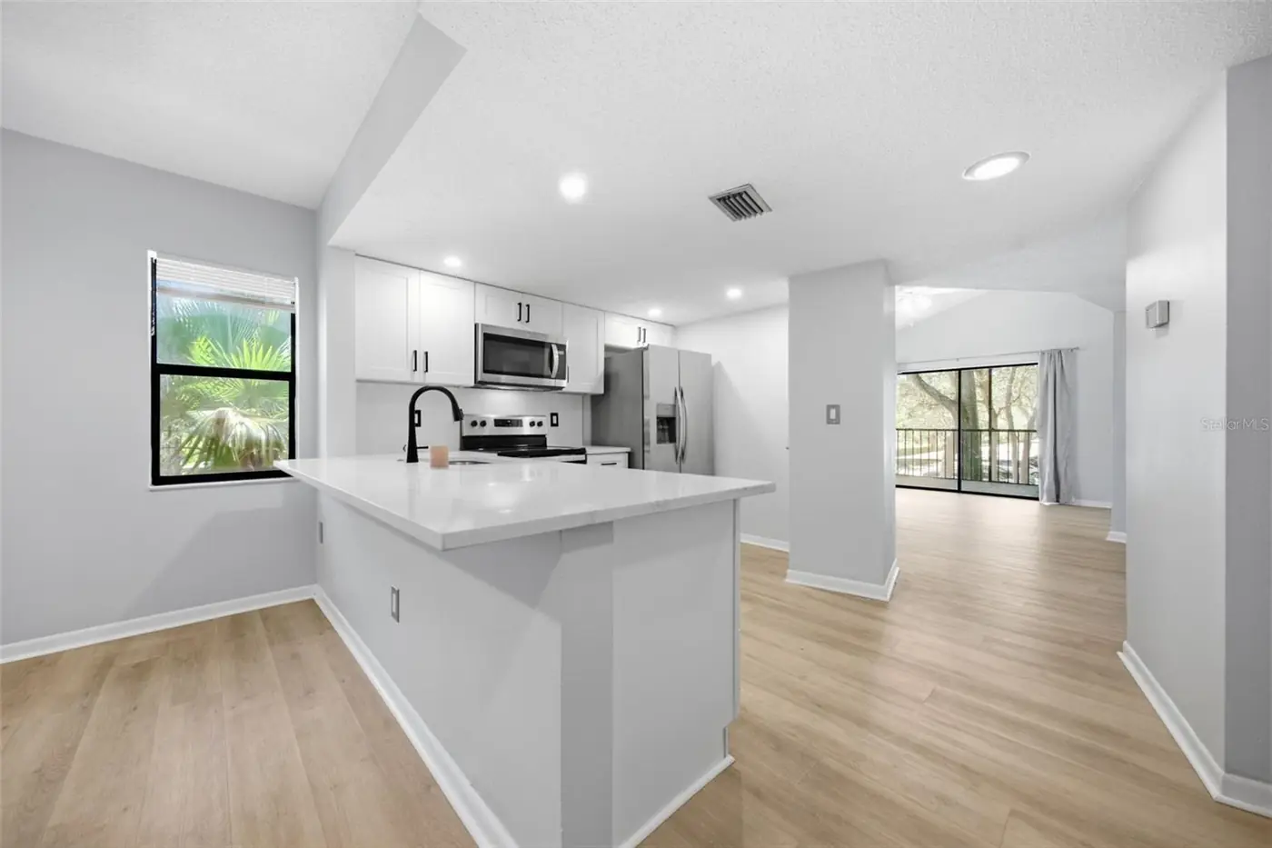 Open plan kitchen and living area, 300 S Florida Ave #100K, Tarpon Springs